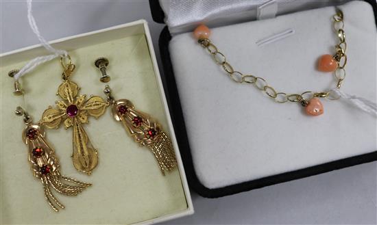 A yellow metal and ruby cross pendant (tests as 14ct), a similar pair of garnet-set earrings and a 9ct gold and coral necklace